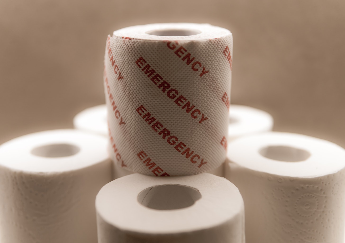 Toilet paper with emergency written on it.